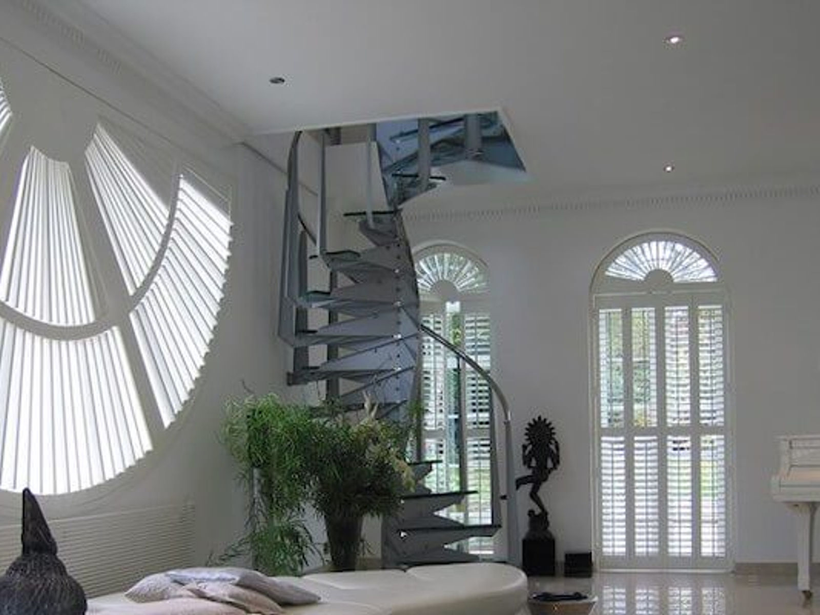 Bespoke shaped shutters for an arched window in Kent
