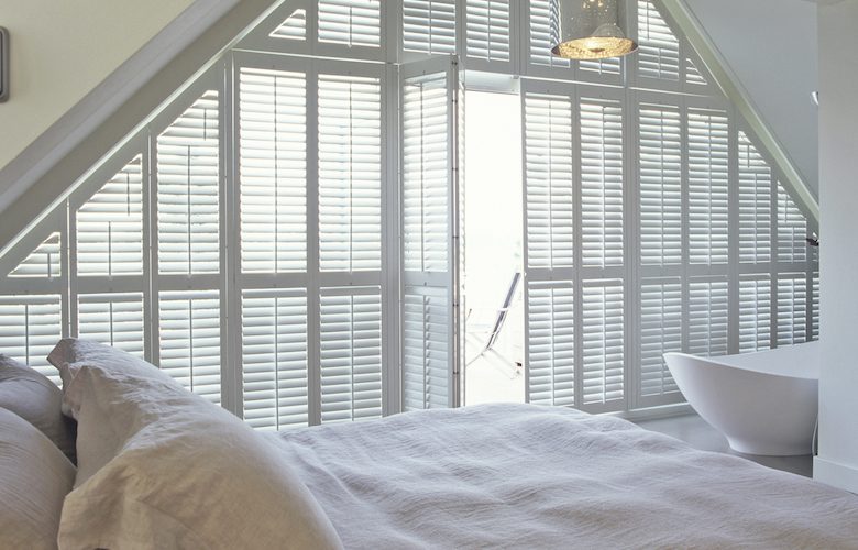 Shaped shutters in the bedroom